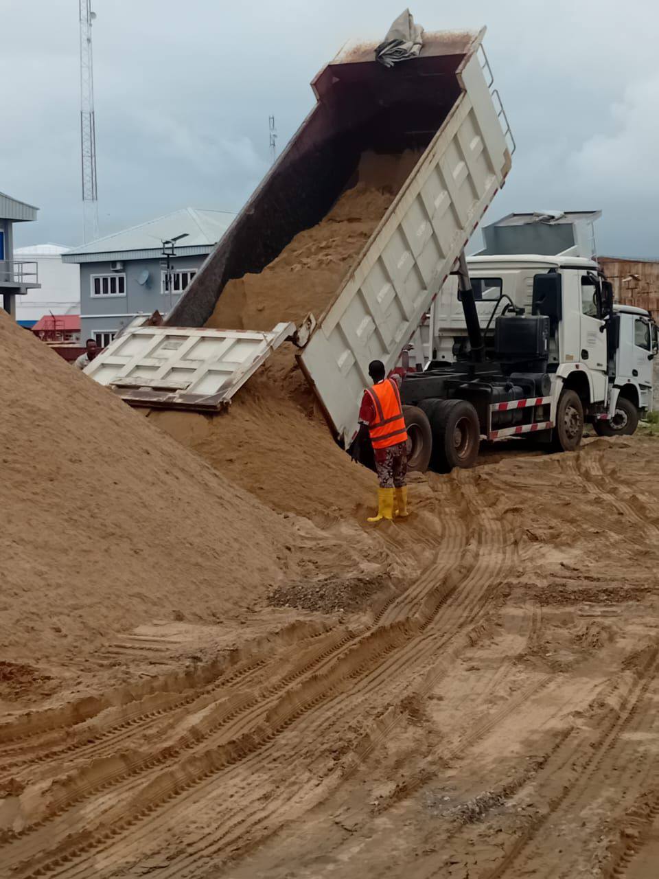 Construction site with excavators and scaffolding